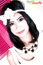 Num Li wearing white head band and necklace