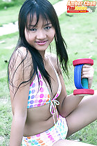 Seated in bikini working out with weight
